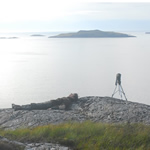 Birdwatcher resting - Scoraig peninsula view of the Summer Isles